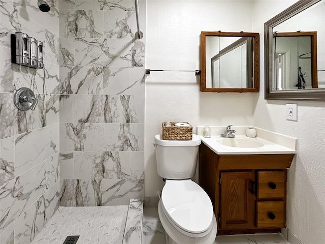 6803 Las Brisas Dr, Houston, TX 77083 - bathroom with vanity, marble finish floor, a tile shower, and toilet