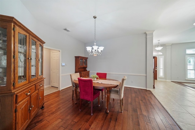 25702 Serene Spring Ln, Spring, TX 77373 - dining area with a chandelier, hardwood / wood-style flooring, and baseboards