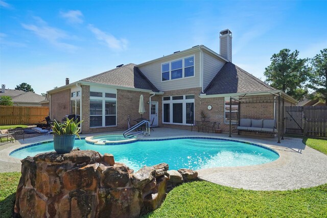 view of pool featuring a patio, an in ground hot tub, fence, and a fenced in pool
