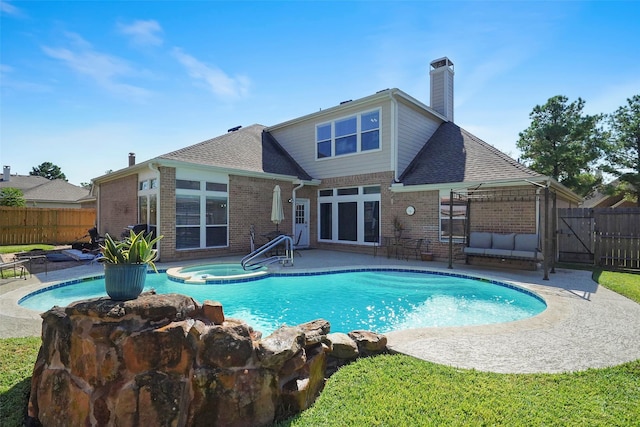 25702 Serene Spring Ln, Spring, TX 77373 - view of pool featuring fence, a patio, and a pool with connected hot tub