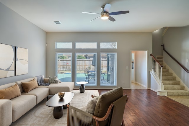 25702 Serene Spring Ln, Spring, TX 77373 - living area with wood finished floors, a ceiling fan, stairs, and baseboards