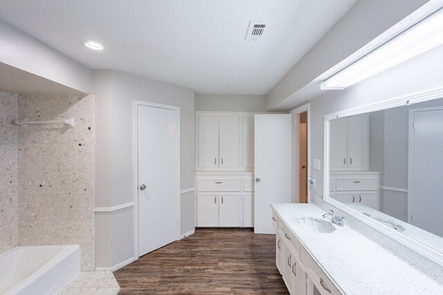 15807 Ripplewind Ln, Houston, TX 77068 - full bath featuring wood finished floors, vanity, bathing tub / shower combination, and recessed lighting