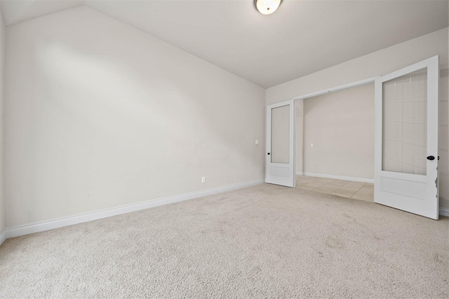 11018 Croftmore Dr, Richmond, TX 77407 - unfurnished bedroom featuring baseboards, carpet flooring, and lofted ceiling
