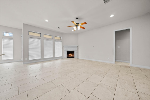 11018 Croftmore Dr, Richmond, TX 77407 - unfurnished living room featuring ceiling fan, a lit fireplace, visible vents, recessed lighting, and light tile patterned flooring