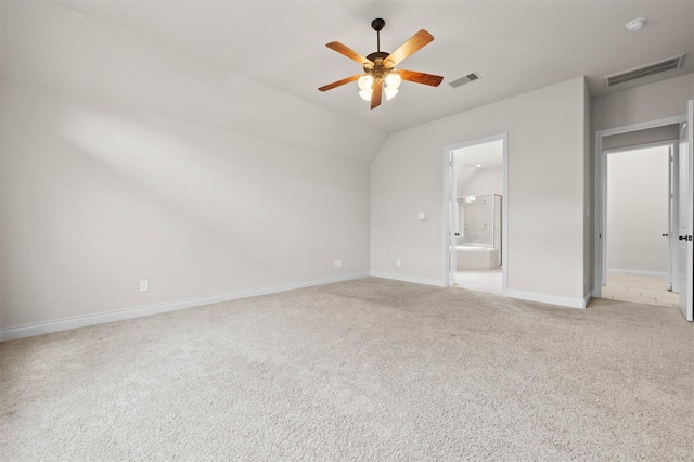 11018 Croftmore Dr, Richmond, TX 77407 - unfurnished bedroom with visible vents, baseboards, lofted ceiling, and light carpet