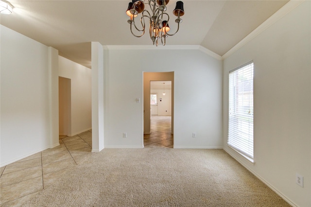 empty room with crown molding, light colored carpet, a chandelier, baseboards, and lofted ceiling