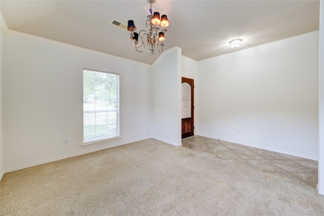carpeted empty room featuring baseboards, visible vents, lofted ceiling, and a notable chandelier