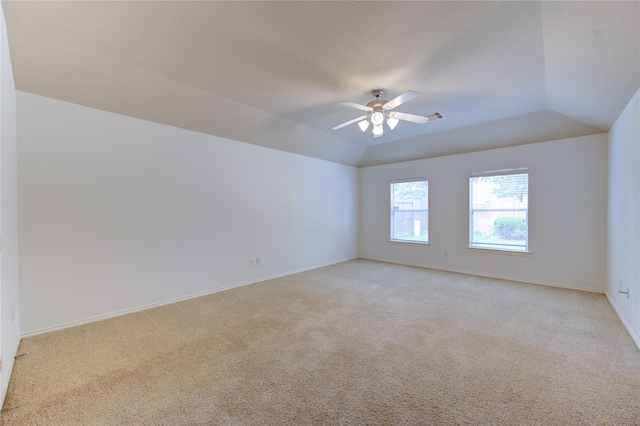 unfurnished room featuring a ceiling fan, baseboards, visible vents, and light carpet