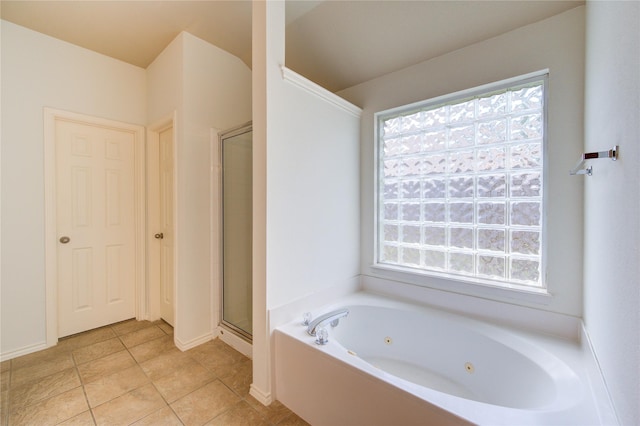 full bathroom with a whirlpool tub, tile patterned flooring, a stall shower, and a healthy amount of sunlight