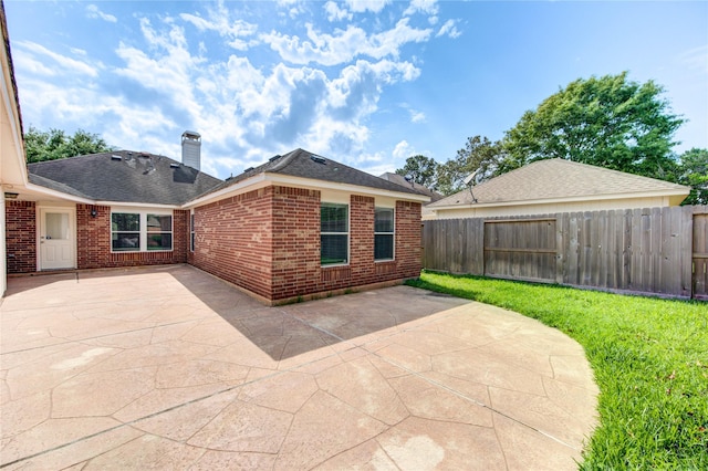 view of patio featuring fence