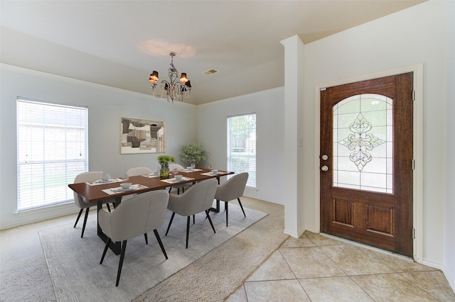 26707 Abbey Springs Ln, Katy, TX 77494 - dining area featuring light carpet, a chandelier, baseboards, light tile patterned floors, and visible vents