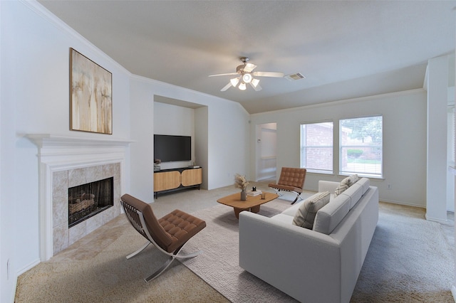 26707 Abbey Springs Ln, Katy, TX 77494 - living room featuring ceiling fan, light colored carpet, a fireplace, visible vents, and ornamental molding