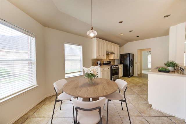 26707 Abbey Springs Ln, Katy, TX 77494 - dining space with light tile patterned floors, vaulted ceiling, and recessed lighting