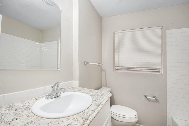 full bathroom featuring walk in shower, vanity, toilet, visible vents, and a bath