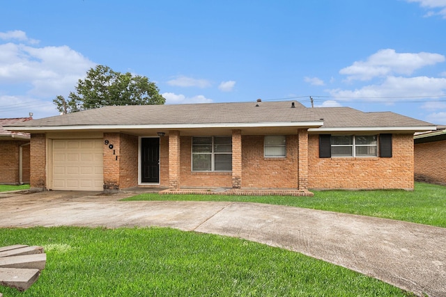 single story home with an attached garage, concrete driveway, a front lawn, and brick siding