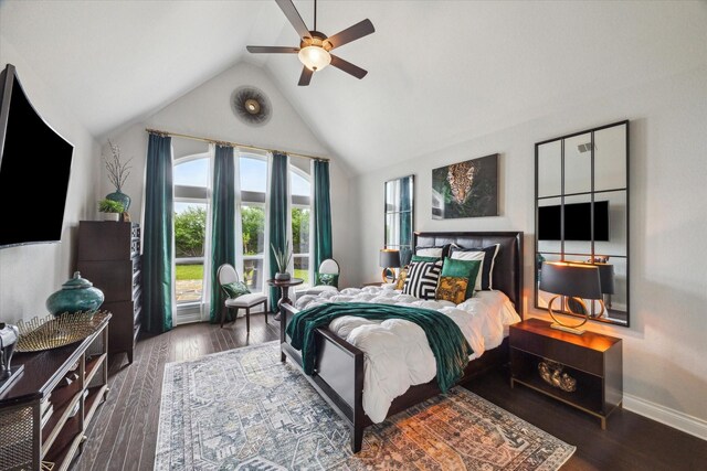 bedroom with baseboards, multiple windows, a ceiling fan, and wood finished floors