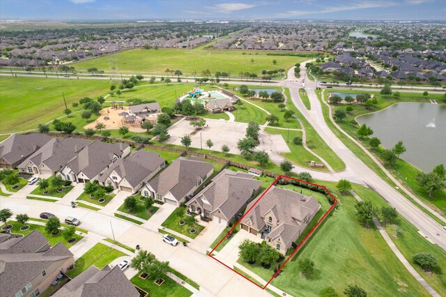 bird's eye view featuring a water view and a residential view