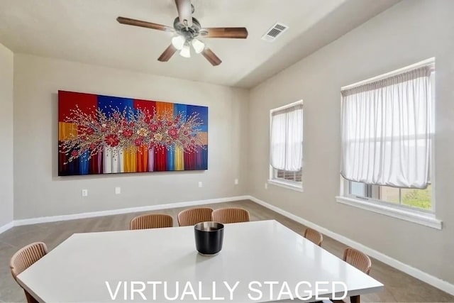 unfurnished dining area featuring baseboards, ceiling fan, and visible vents