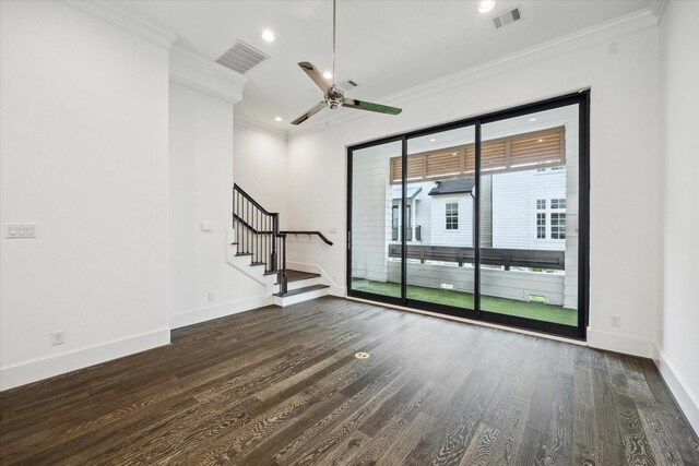 empty room featuring visible vents, ornamental molding, and stairs