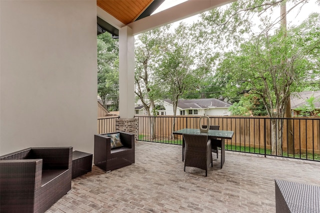 view of patio featuring a deck, outdoor lounge area, and outdoor dining space
