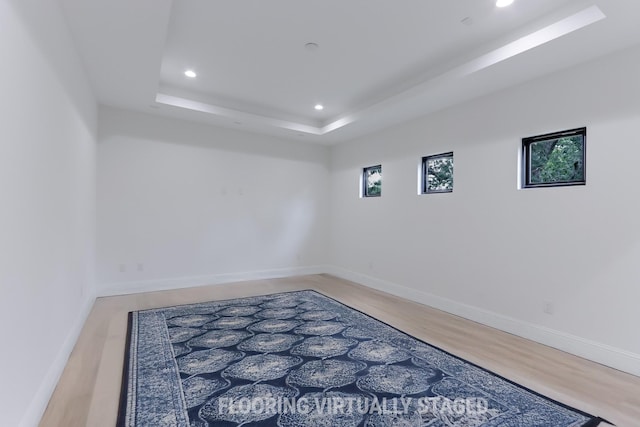interior space featuring recessed lighting, baseboards, plenty of natural light, and wood finished floors