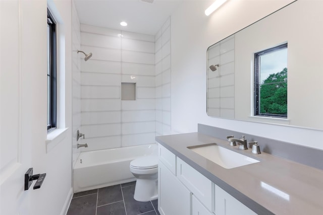 bathroom featuring vanity, shower / bath combination, tile patterned flooring, and toilet