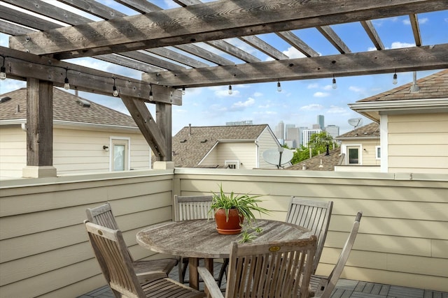 balcony featuring a pergola and outdoor dining space