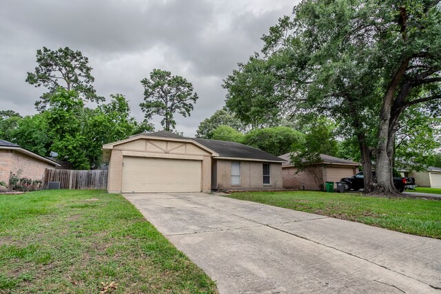 ranch-style home featuring brick siding, a garage, fence, and driveway