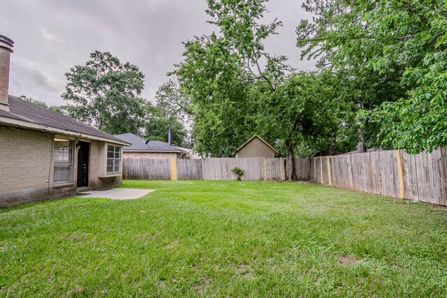 view of yard featuring a fenced backyard