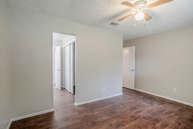 4523 Towergate Dr, Spring, TX 77373 - spare room featuring wood finished floors, a textured ceiling, ceiling fan, and baseboards