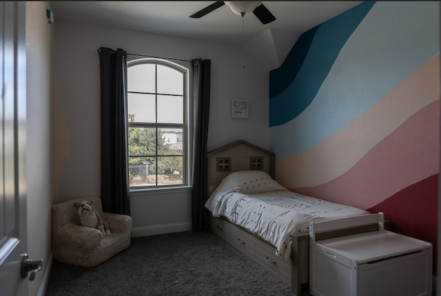 carpeted bedroom with baseboards and ceiling fan
