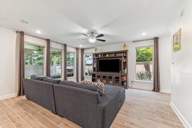 26 Heirloom Garden Pl, Magnolia, TX 77354 - living room featuring a ceiling fan, light wood-type flooring, baseboards, and recessed lighting