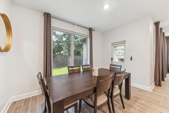 26 Heirloom Garden Pl, Magnolia, TX 77354 - dining space with light wood finished floors and baseboards