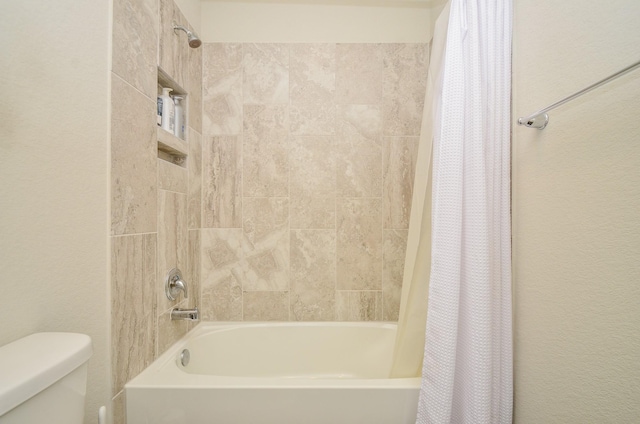 12630 Beddington Ct, Tomball, TX 77375 - bathroom featuring toilet and shower / tub combo