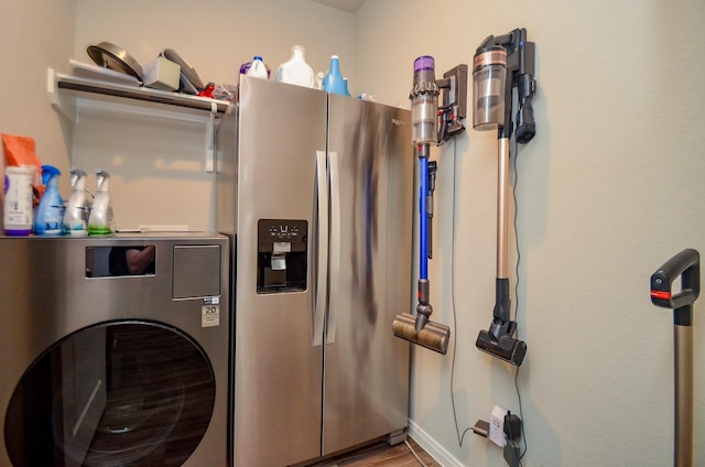 12630 Beddington Ct, Tomball, TX 77375 - laundry room with laundry area, washer / dryer, and wood finished floors