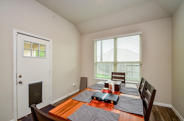 12630 Beddington Ct, Tomball, TX 77375 - dining room featuring baseboards, dark wood finished floors, and vaulted ceiling