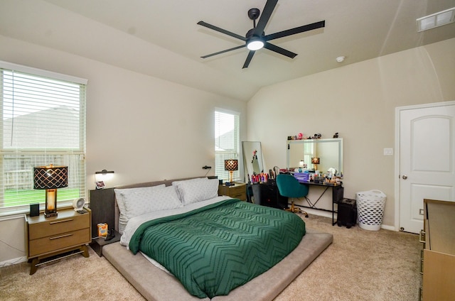 12630 Beddington Ct, Tomball, TX 77375 - bedroom with a ceiling fan, light carpet, lofted ceiling, and visible vents
