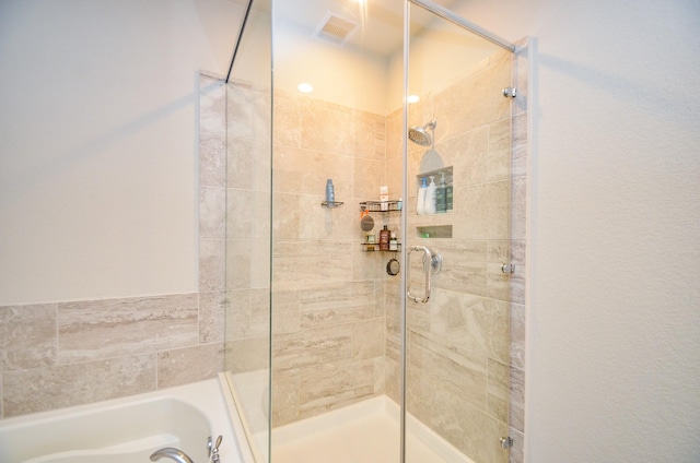 12630 Beddington Ct, Tomball, TX 77375 - full bathroom featuring a shower stall, a garden tub, and visible vents