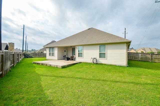 12630 Beddington Ct, Tomball, TX 77375 - rear view of property featuring a fenced backyard, a patio, ceiling fan, and a lawn
