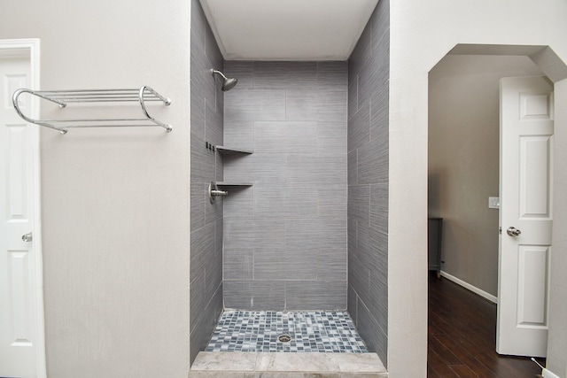 7318 River Garden Dr, Houston, TX 77095 - bathroom with tiled shower and wood finished floors