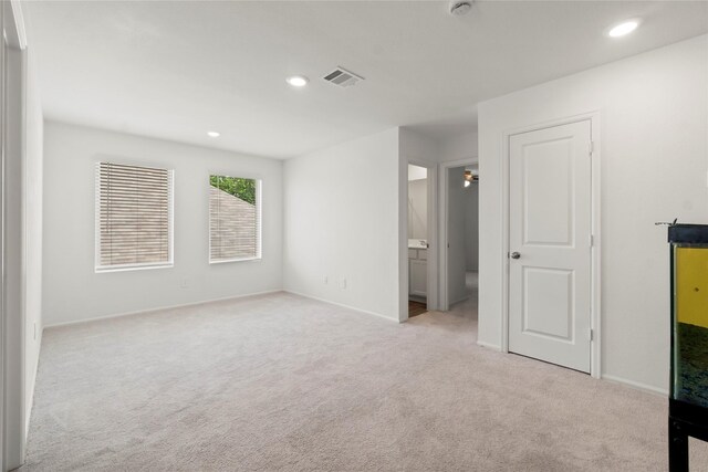 unfurnished bedroom with visible vents, carpet flooring, baseboards, and recessed lighting