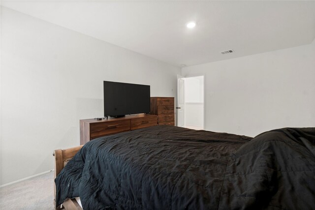 bedroom with baseboards, carpet, and visible vents
