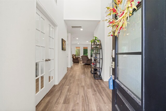 entryway featuring visible vents, recessed lighting, wood finished floors, and french doors