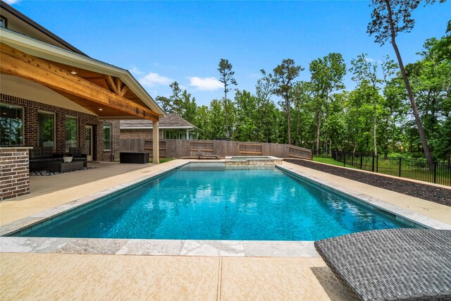 view of swimming pool featuring a fenced backyard, a patio, an outdoor living space, and a pool with connected hot tub