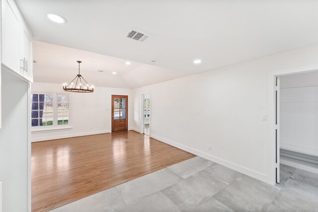 interior space with an inviting chandelier, baseboards, recessed lighting, and visible vents