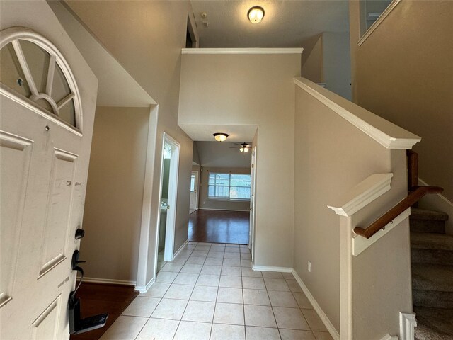 16407 Thyme Green Ln, Cypress, TX 77433 - foyer featuring light tile patterned flooring, baseboards, stairway, and ceiling fan