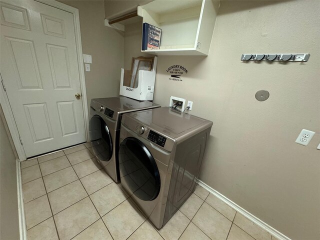 16407 Thyme Green Ln, Cypress, TX 77433 - washroom with washing machine and dryer, light tile patterned floors, and baseboards