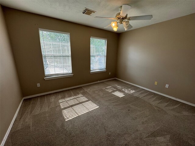 16407 Thyme Green Ln, Cypress, TX 77433 - spare room with carpet, a ceiling fan, and baseboards