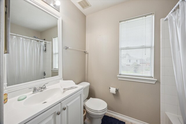 16407 Thyme Green Ln, Cypress, TX 77433 - full bathroom featuring vanity, toilet, baseboards, and shower / tub combo with curtain