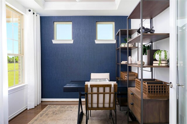 home office featuring baseboards, ornamental molding, wood finished floors, and a raised ceiling
